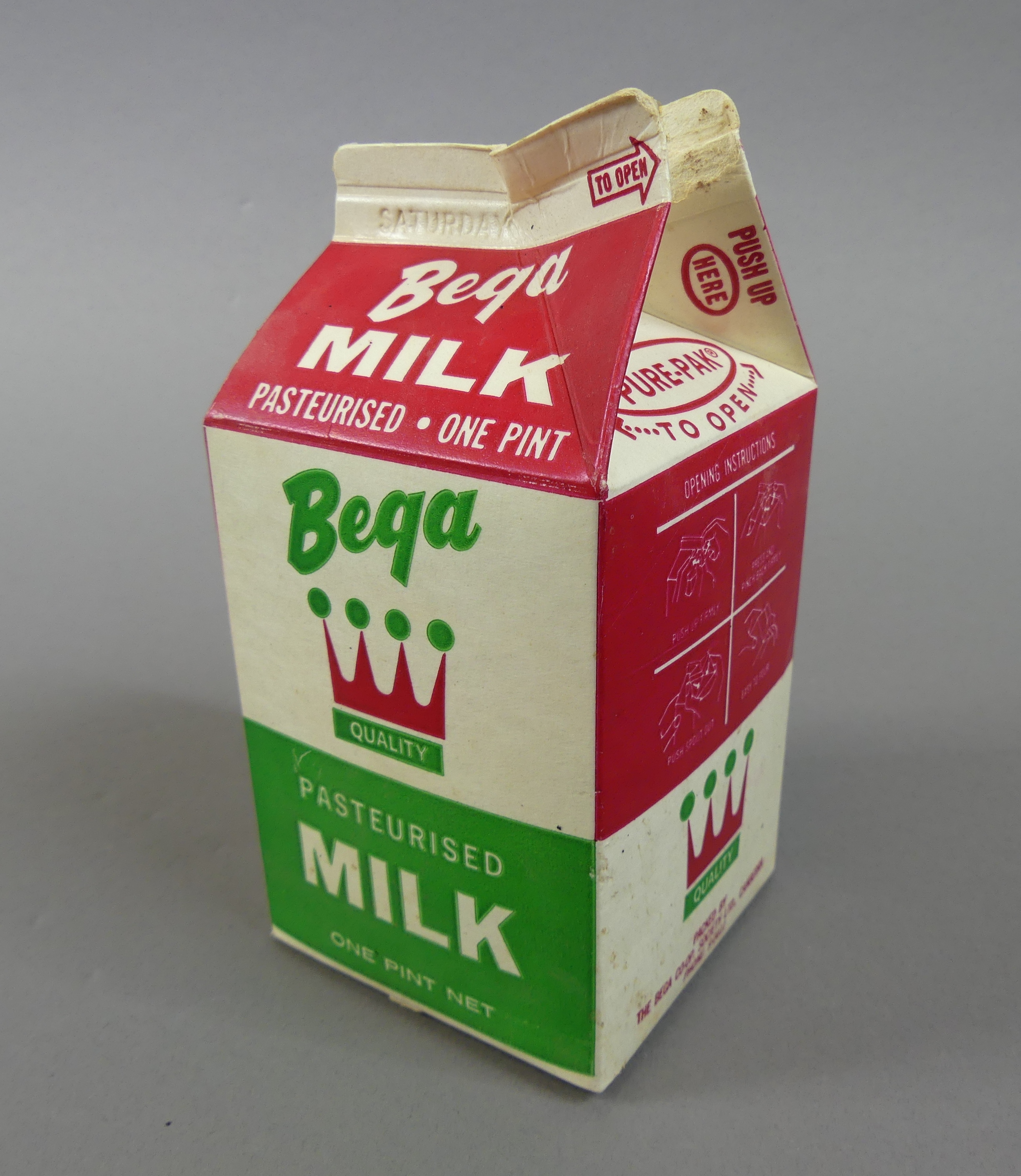 A small open carton of Bega milk.