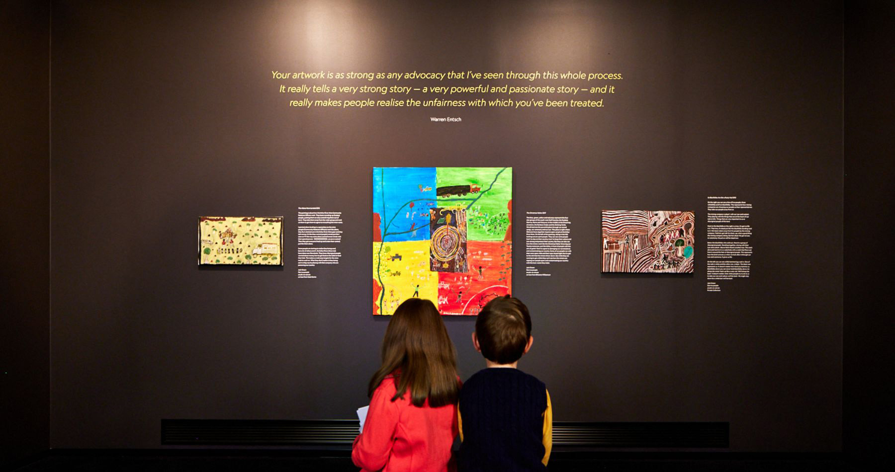 Two children looking at one of the features Two children looking at one of the features
