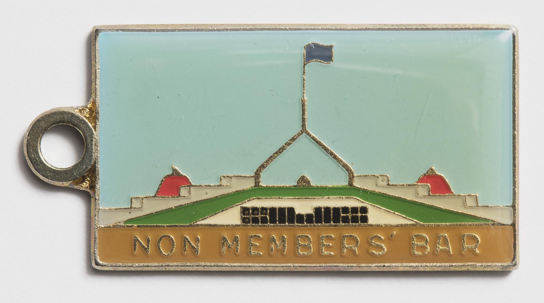 Photograph of a metal tag labled "Non members bar"