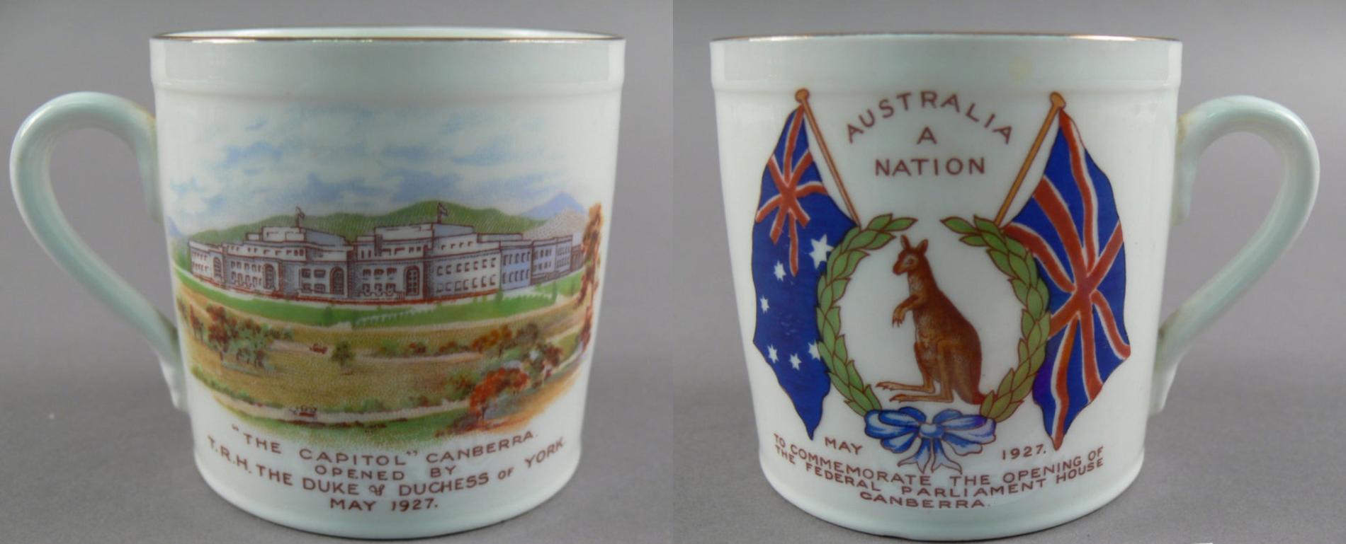 Souvenir mug from 1927, the front depicting parliament house surrounded by green hills and fields, the back showing a wreath with a kangaroo and the Australian and UK flags.