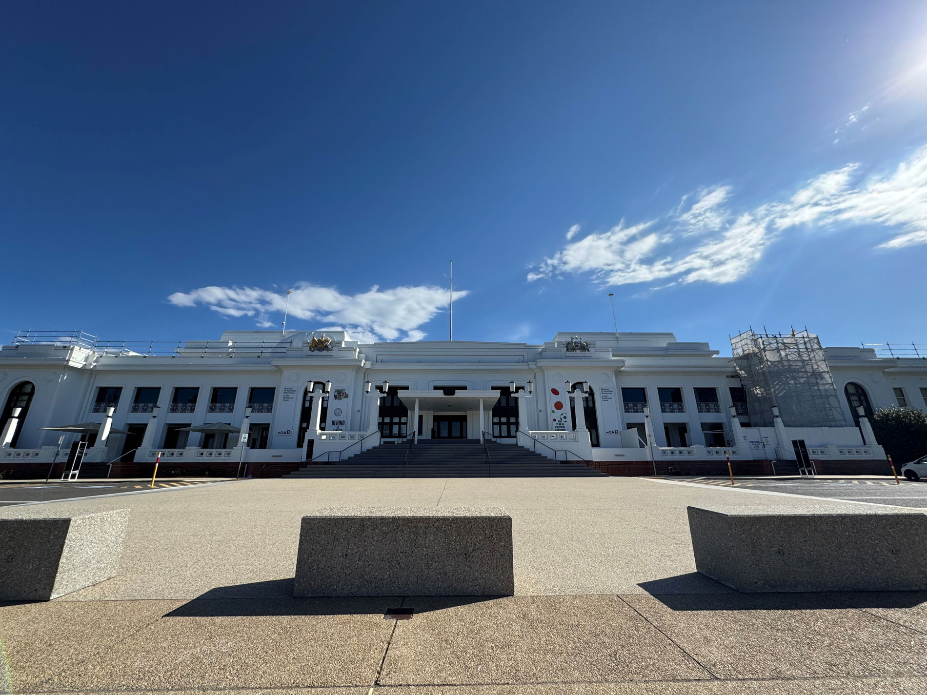 The front of Old Parliament House in Canberra with scaffolding on the right of the buildling.