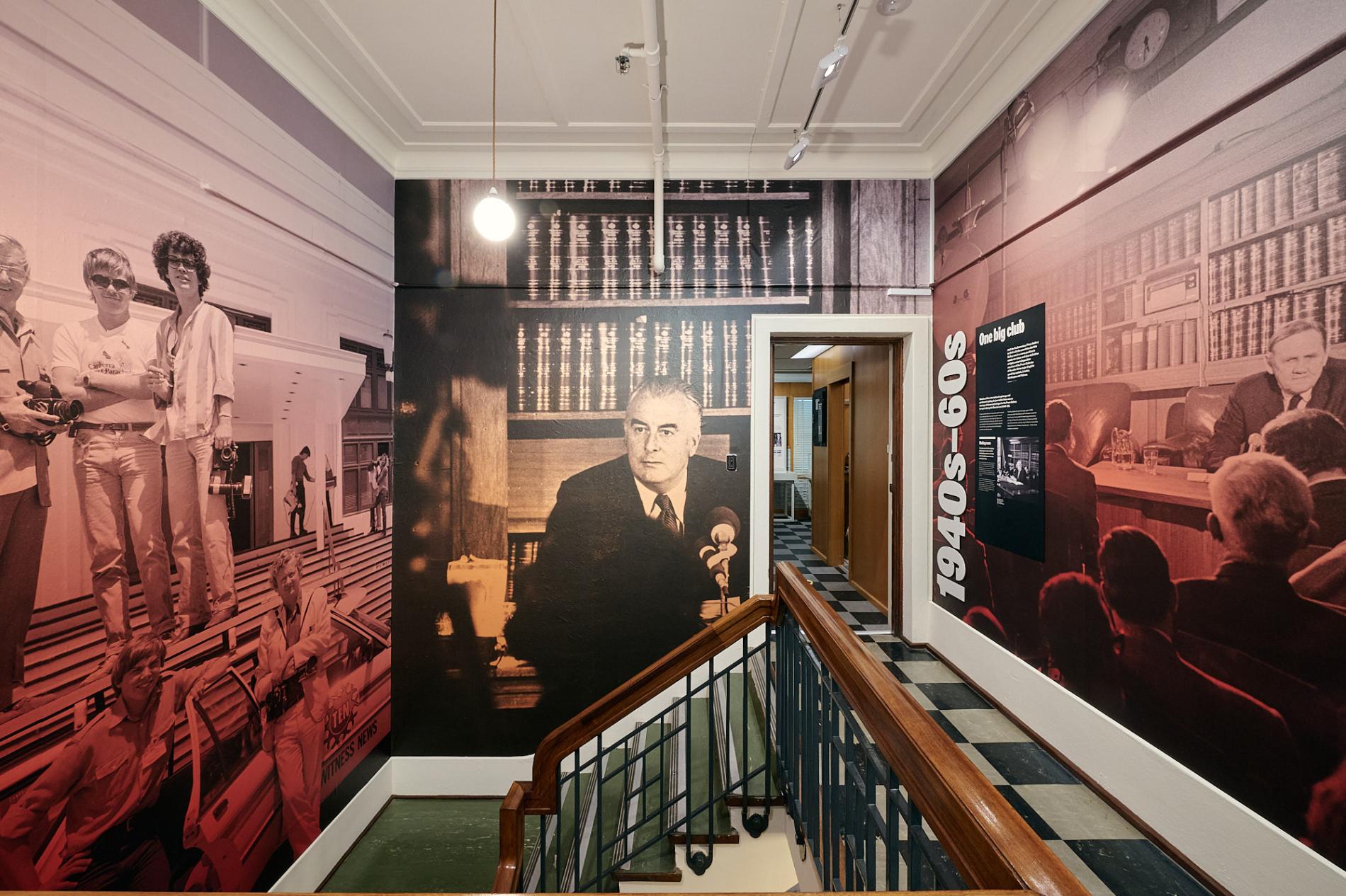 Large visuals of Gough Whitlam, John Gorton and press on the walls in the Press Gallery exhibition at Old Parliament House.