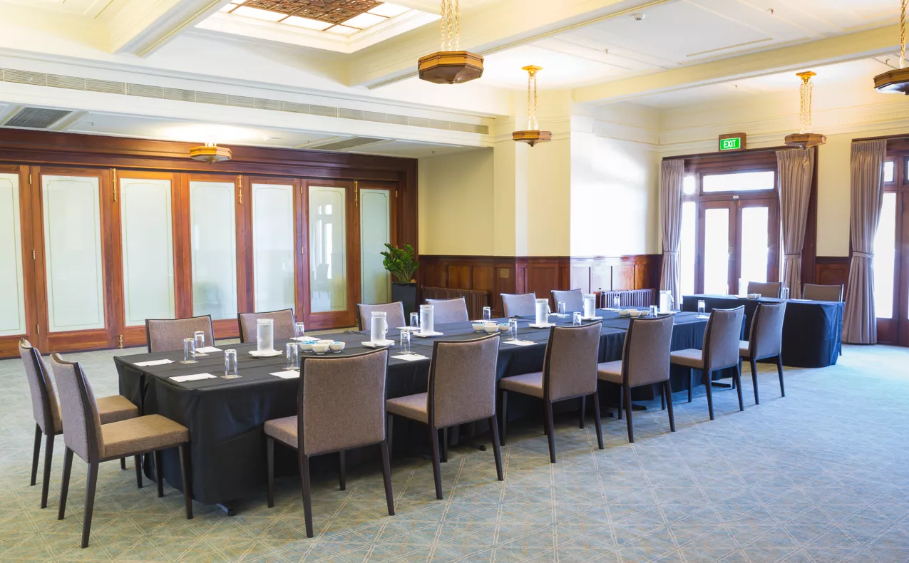 The members dining room with a long rectangular table. 