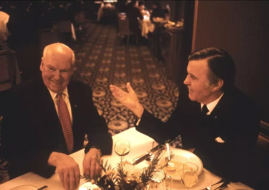 Fred Daly and Jim Killen sit at a dining table Fred Daly and Jim Killen sit at a dining table