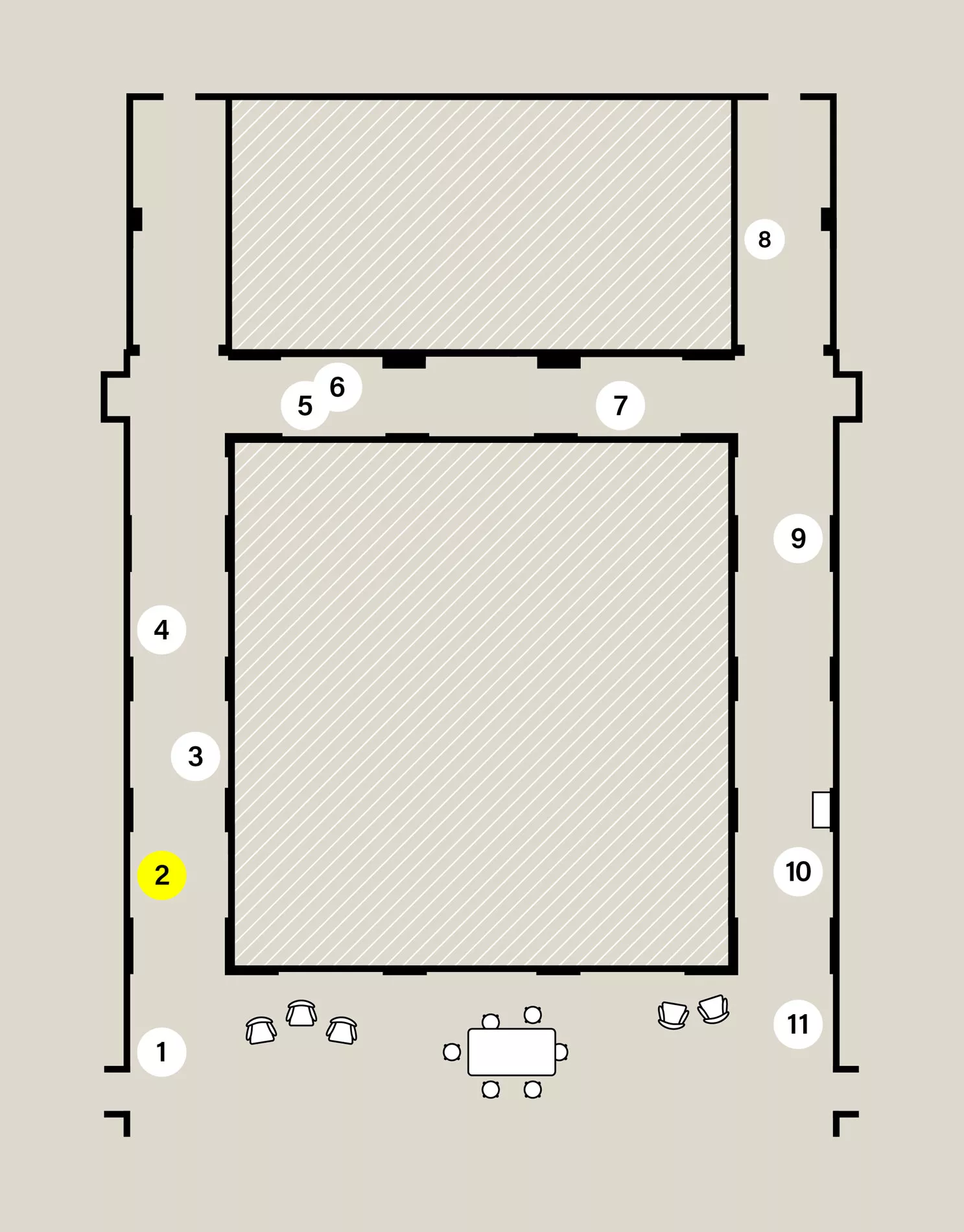 Map of a capital H-shaped exhibition space. Eleven numbered white circles show the location of stops on the audio tour. Stop 2 is highlighted yellow.