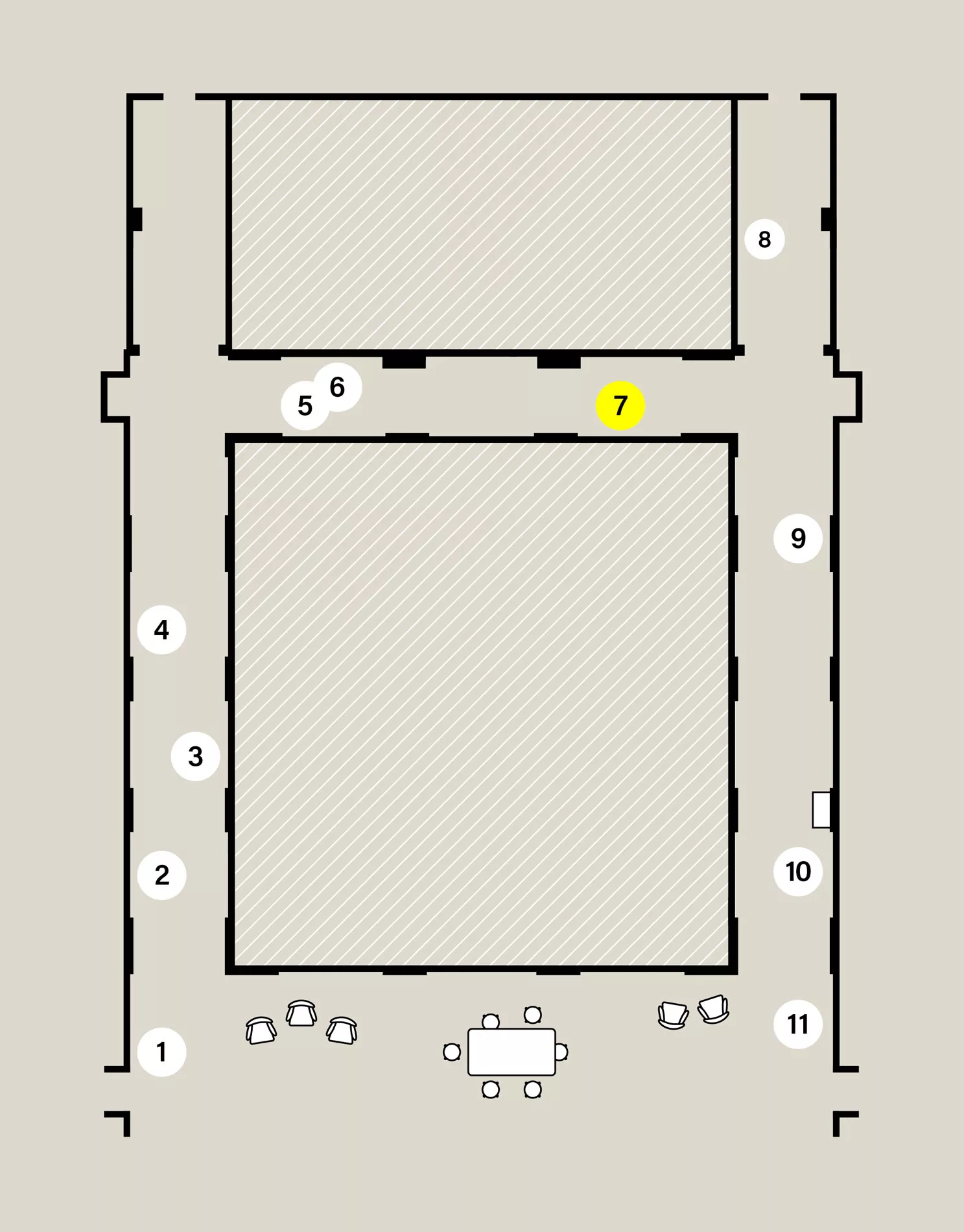 Map of a capital H-shaped exhibition space. Eleven numbered white circles show the location of stops on the audio tour. Stop 7 is highlighted yellow.