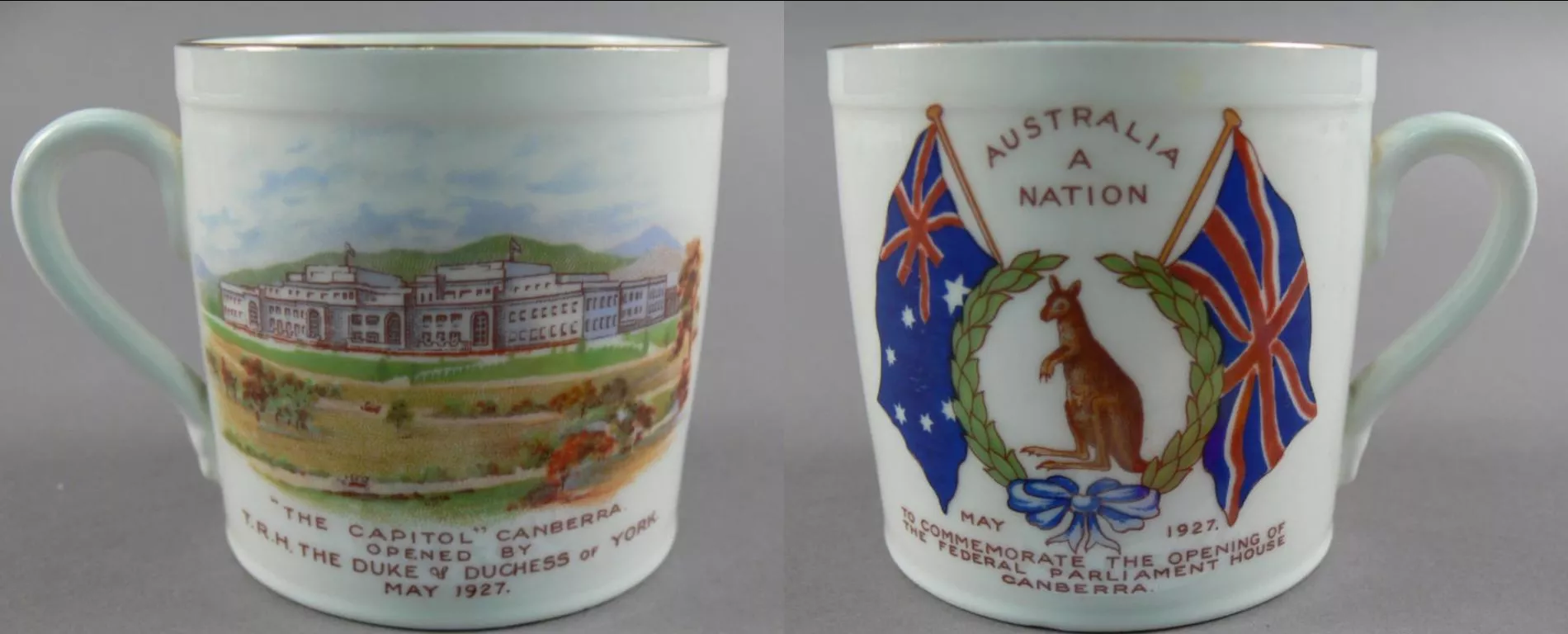 Souvenir mug from 1927, the front depicting parliament house surrounded by green hills and fields, the back showing a wreath with a kangaroo and the Australian and UK flags.