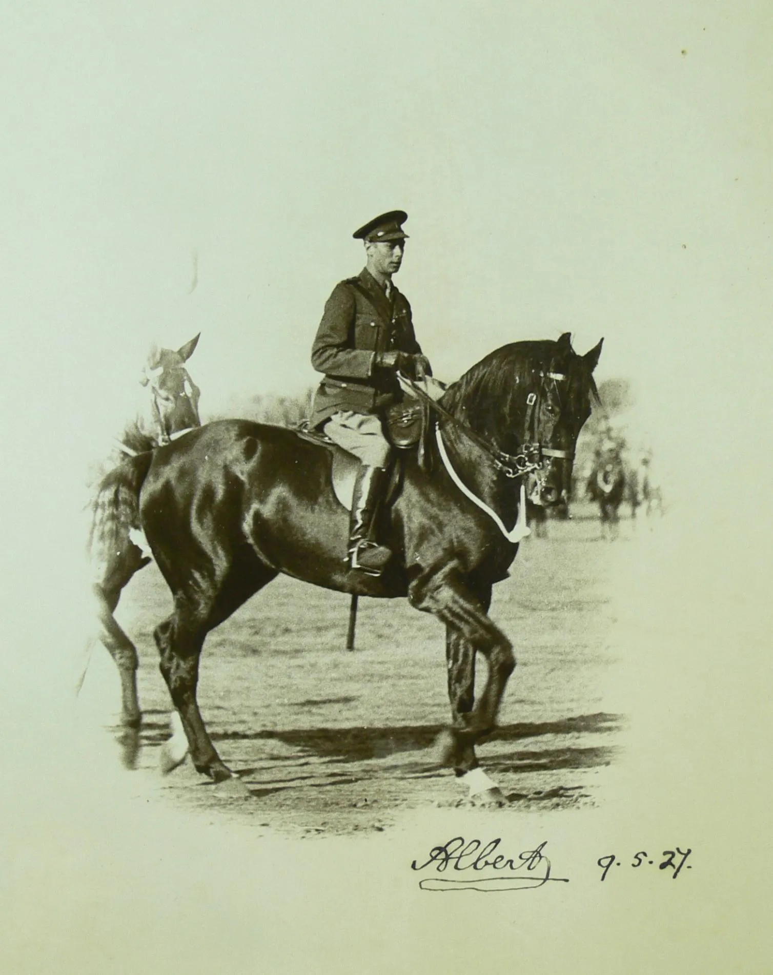 The Duke of York rides a horse in a park in Canberra. The image is signed 'Albert' with the date 9.5.27.