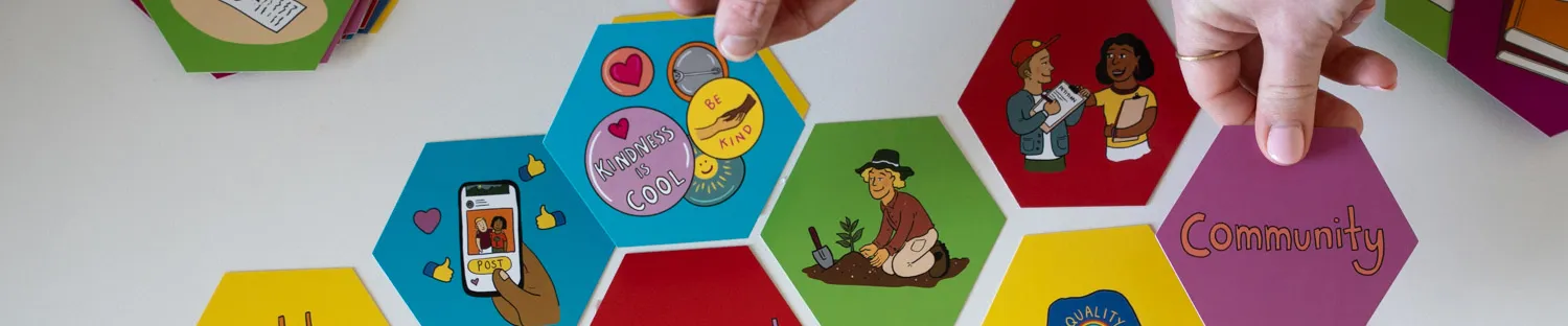 Hexagonal coloured tiles featuring words about civics and democracy.