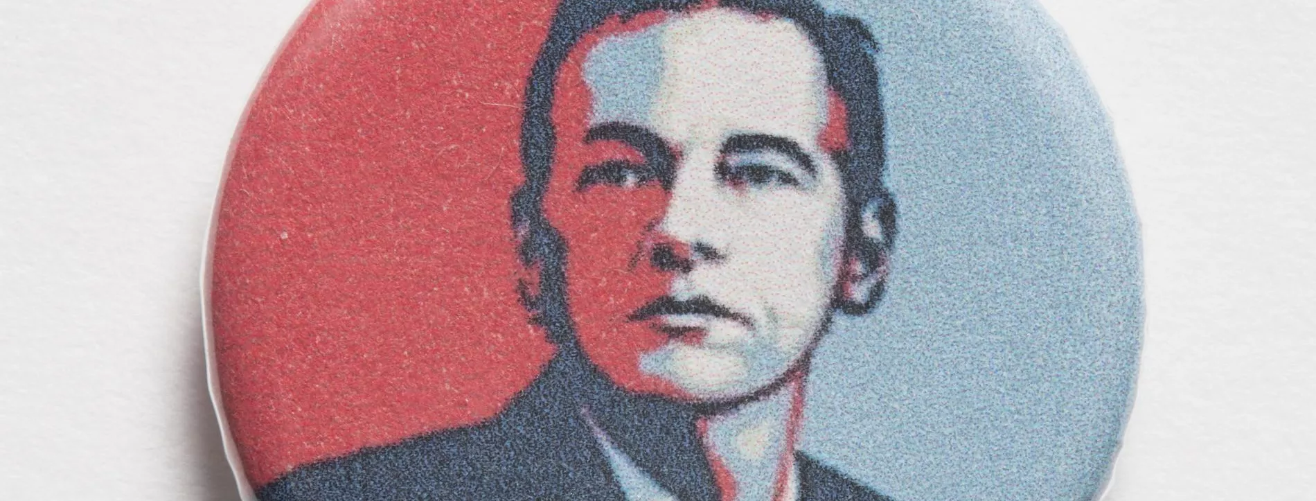 Photograph of a small badge labled "Free Julian"