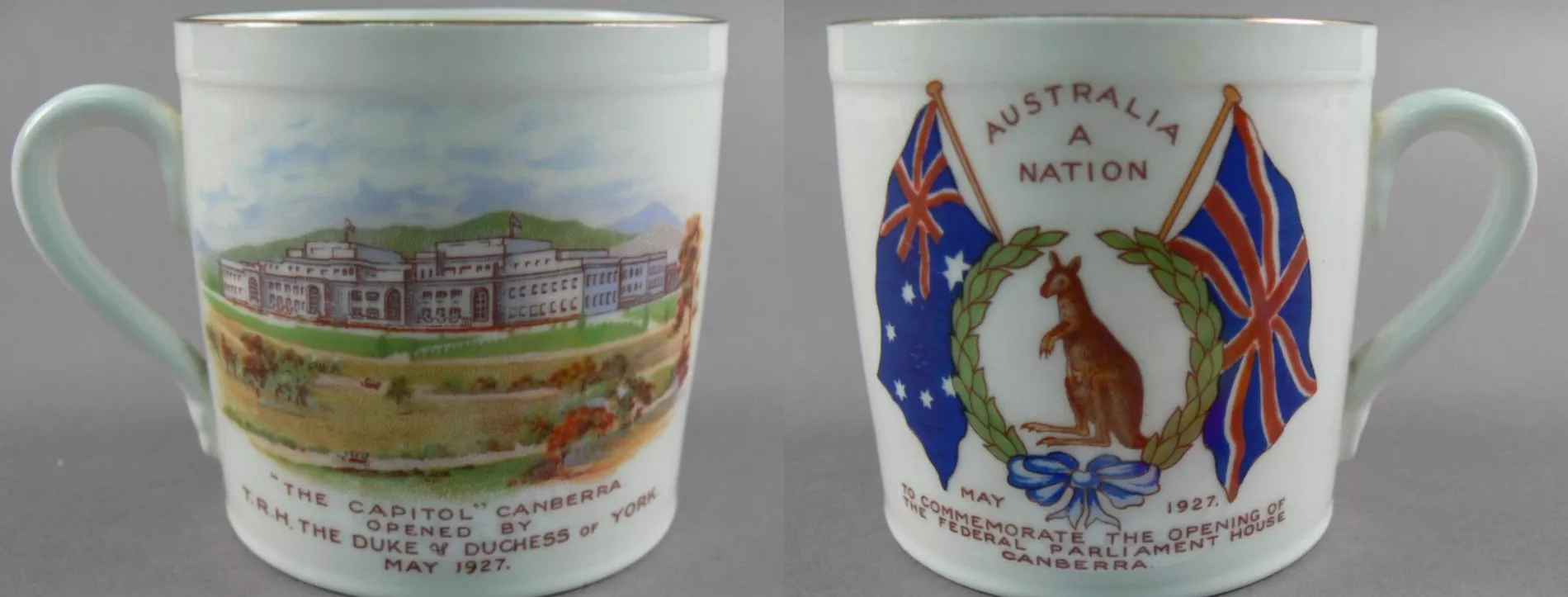 Souvenir mug from 1927, the front depicting parliament house surrounded by green hills and fields, the back showing a wreath with a kangaroo and the Australian and UK flags.