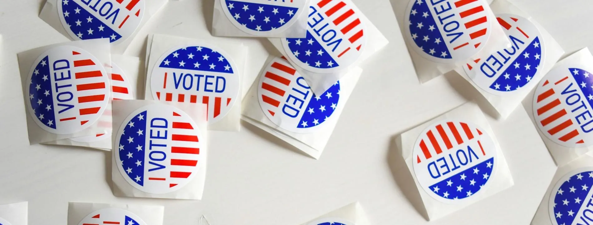 Round stickers depicting the US flag's stars and stripes, with the words 'I voted'.