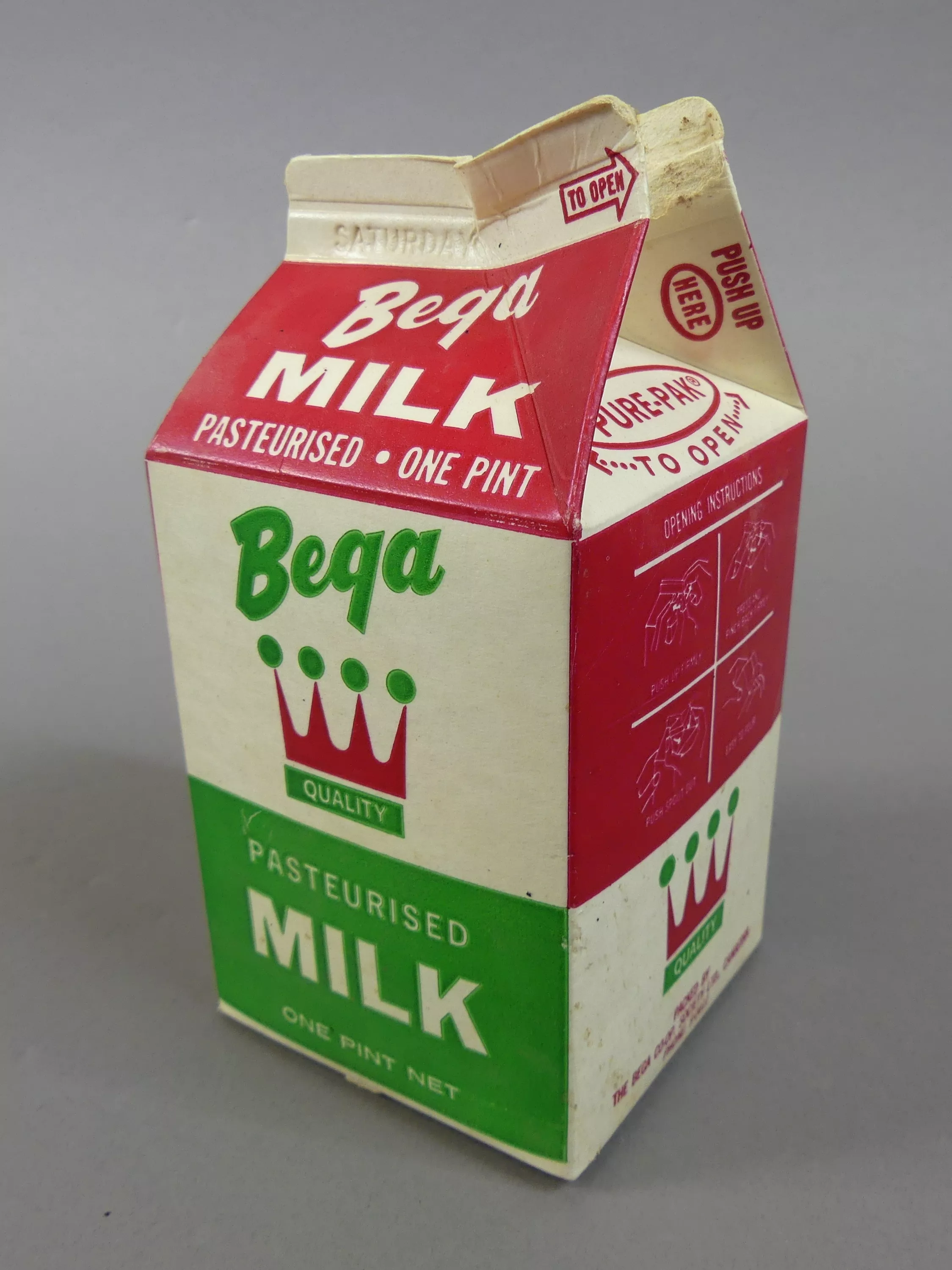 A small open carton of Bega milk.