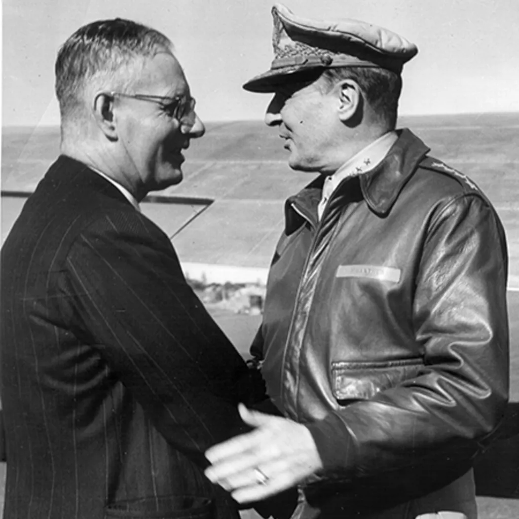 Curtin shakes hands with MacArthur