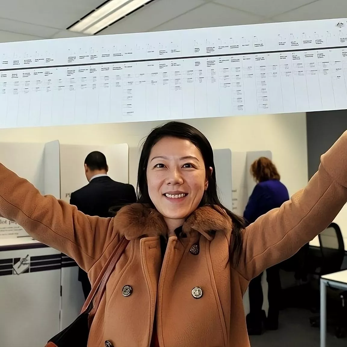 Photograph of a person holding a senate paper.