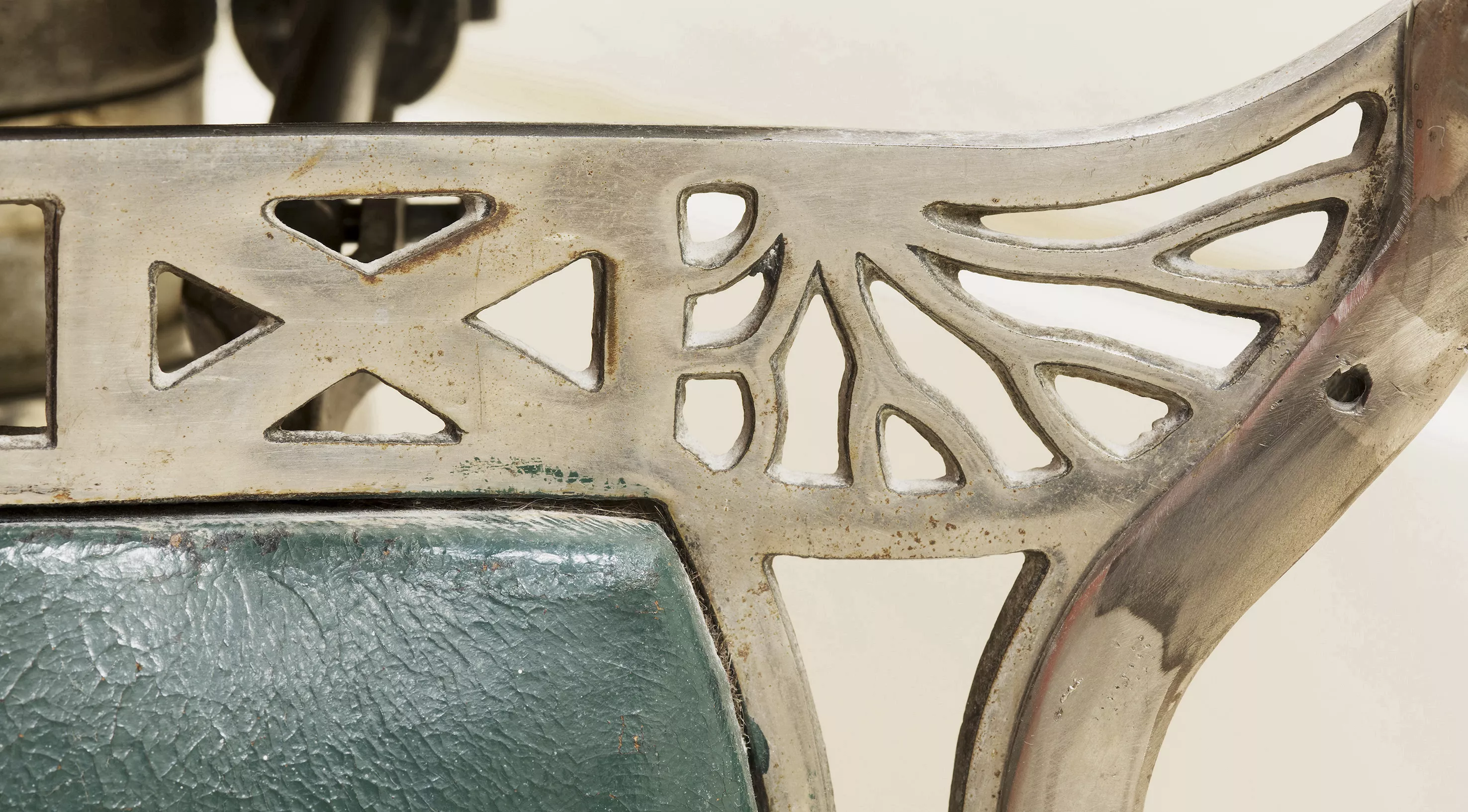 An image of the Parliament barber's chair decorative chrome detail made by Koken.